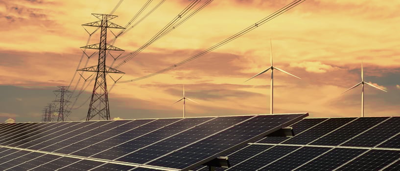 electricity power in nature. clean energy concept. solar panel with turbine and tower hight voltage photo