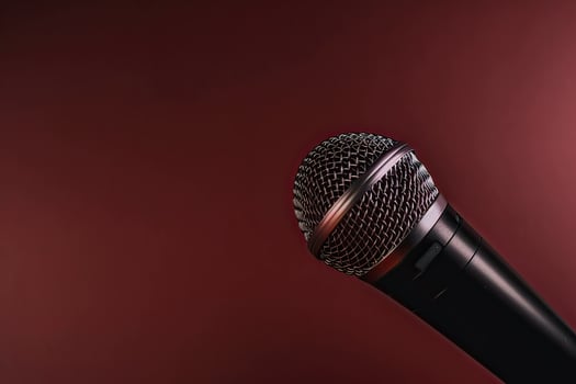 Close-up microphone. microphone isolated on vibrant background, banner with copy space. . photo