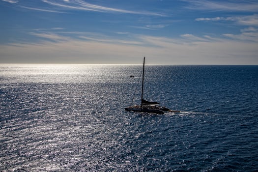 sea landscape on a sunny day with blue sky and water and a sailing ship photo