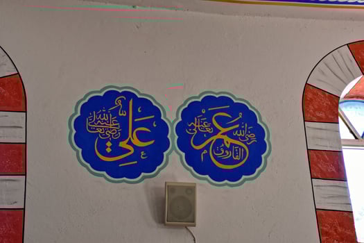 modest simple interior of a small Turkish village mosque with one miner photo