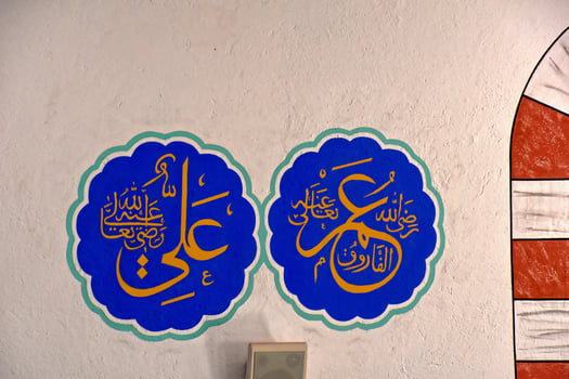 modest simple interior of a small Turkish village mosque with one miner photo