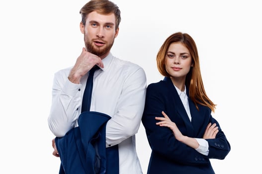 young couple wearing suits stands next to work colleagues communicating finance photo