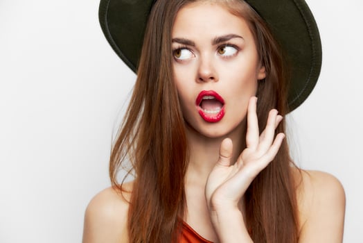 Woman in a hat Open mouth look to the side red lips photo