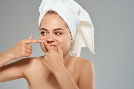 woman with bare shoulders facial skin care acne dermatology photo