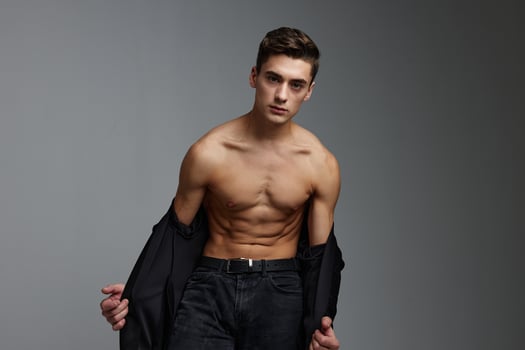 Cute man black jacket nude torso posing self-confidence model photo