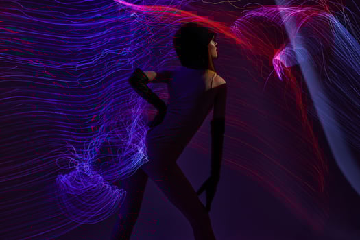 Beauty Fashion woman neon lines light posing studio model unaltered photo