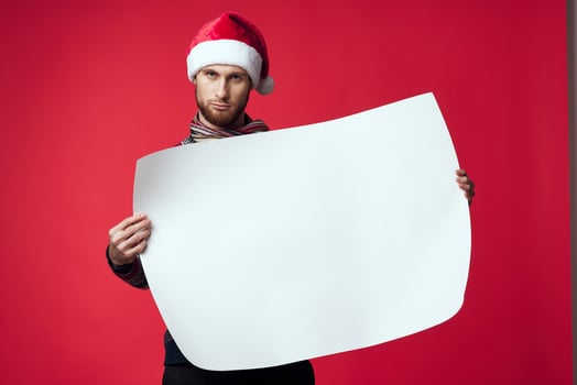 Cheerful man in a christmas white mockup poster studio posing photo