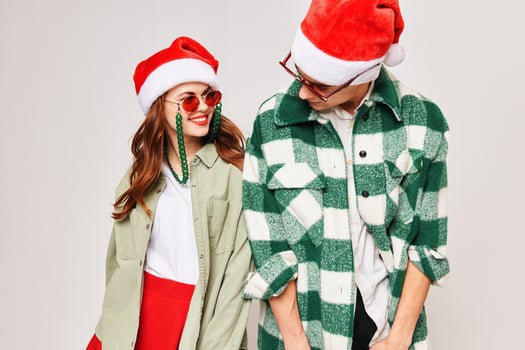 young couple in new year clothes sunglasses fun holiday photo