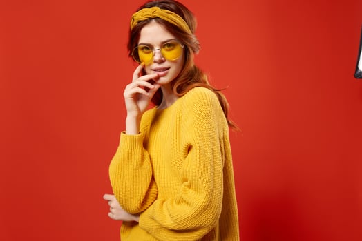 cheerful woman studio smile emotions yellow glasses red background photo
