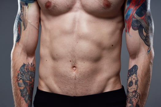 pumped up press tattoo on arm cropped view of workout fitness photo