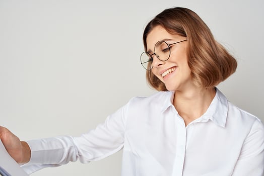 pretty woman in white shirt wearing glasses manager office work photo