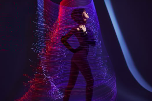 Pretty young female neon lines light posing color background unaltered photo