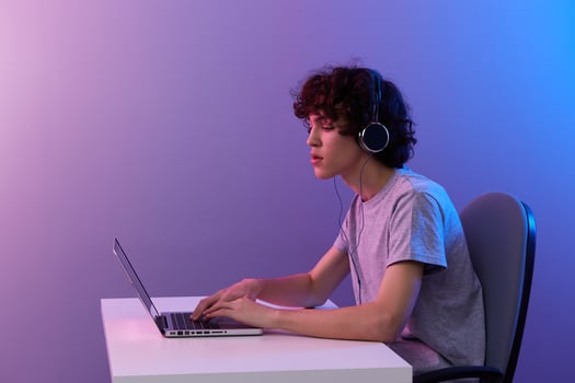 man in headphones in front of laptop entertainment Lifestyle technology photo