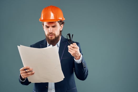 Business man blueprints engineer work professional instruction manual photo