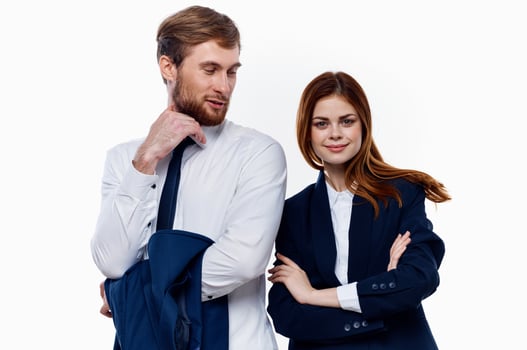 man and woman standing side by side cropped view light background photo