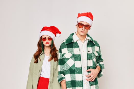 Man and woman in Santa hat Santa holiday Christmas Studio attractive look photo
