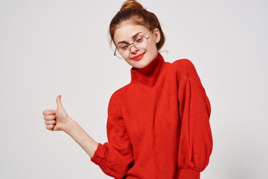 beautiful woman in a red sweater Lifestyle light background photo