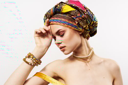 cheerful woman with multi-colored turban on her head decoration posing photo