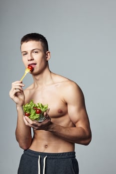 mouse male with bare shoulders and plate of salad healthy food cropped view photo