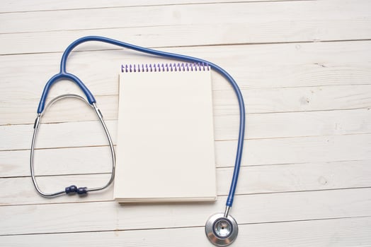 stethoscope with notepad hospital health care photo