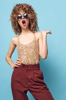 Pretty woman Curly hair emotions open mouth fashionable clothes photo