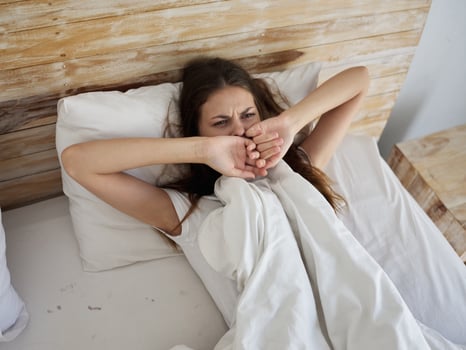 woman lying in bed morning sleeping room photo