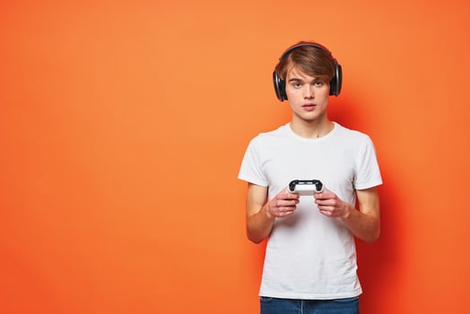 guy in a white t-shirt with a joystick in his hands entertainment games technology photo