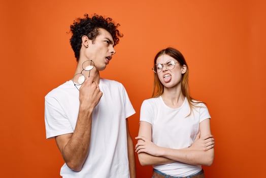 cheerful young couple in white t-shirts wearing glasses emotions photo