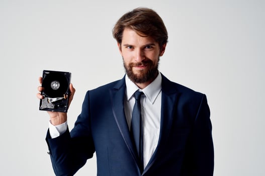 a man in a suit technology hard disk information photo