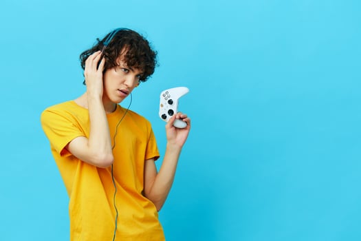 man in headphones plays games gamepad Lifestyle entertainment photo