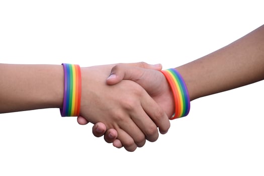 Isolated hands which wear rainbow wristband around them with clipping paths. photo