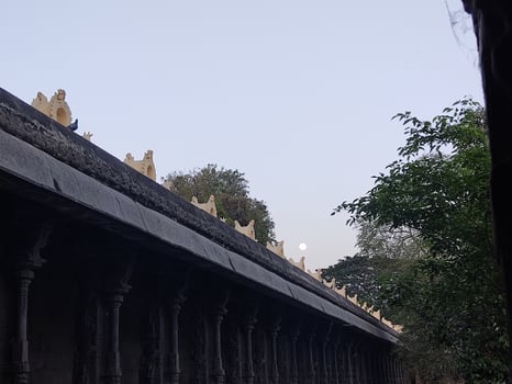The roof of a temple is covered with statues photo
