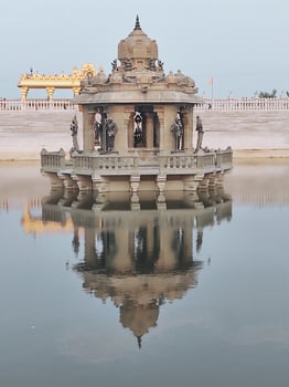 A small temple in the middle of a lake photo