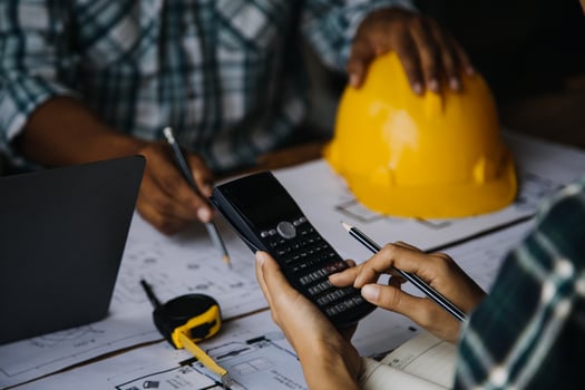 Construction and structure concept of engineer working drawing on blueprint meeting for project working with partner on model building and engineering tools in working site, construction concept photo
