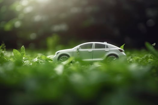 electric car with green leaf icon on blur grass background, ecology and environment concept photo