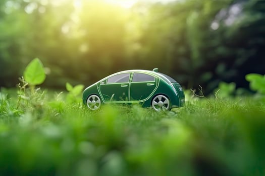 electric car with green leaf icon on blur grass background, ecology and environment concept photo