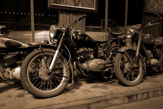 original old vintage retro vintage motorbikes standing in the museum photo