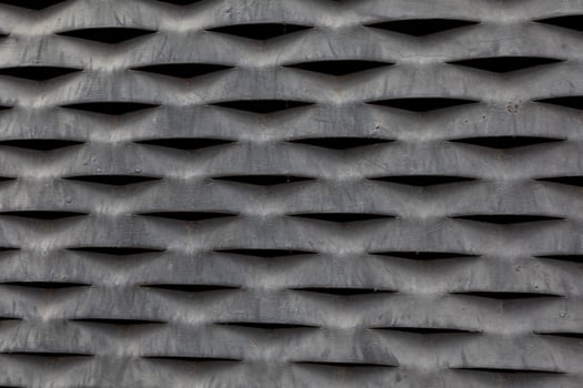 interesting background steel gray industrial coarse mesh in close-up photo