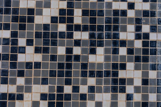 black and white background made of small square ceramic glaze tiles photo