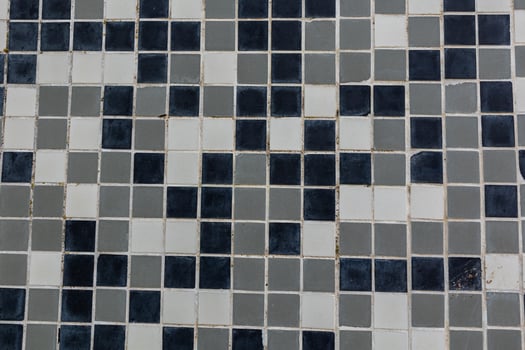 black and white background made of small square ceramic glaze tiles photo