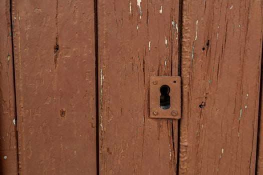 old vintage brown wooden door with keyhole photo