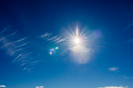 natural landscape background with blue sky, sun and white clouds photo