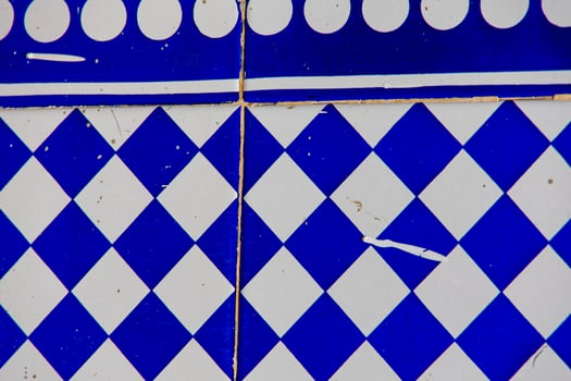 blue and white terracotta glaze tiles in spain traditional decoration background photo