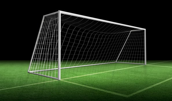 Soccer goal post and soccer net on green grass photo