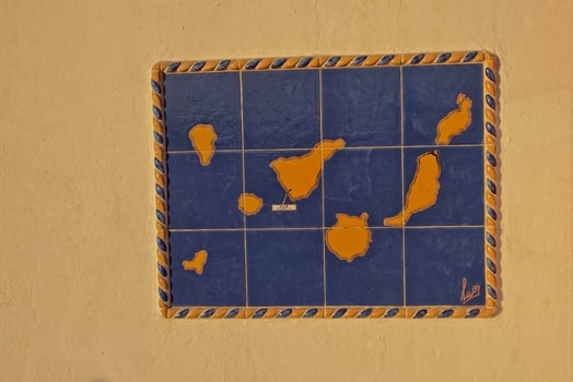 colorful ceramic mosaic with a map of the Spanish Canary Islands on the wall of a building on the island of Tenerife photo