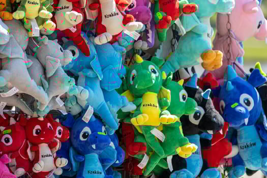 colorful background with plush dragons souvenirs from the Polish city of Krakow photo