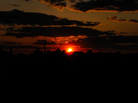 Autumn red sunset with a purple sky photo