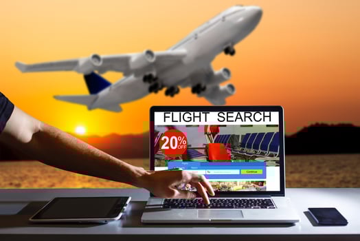 Airplane travel theme with man using a laptop computer photo