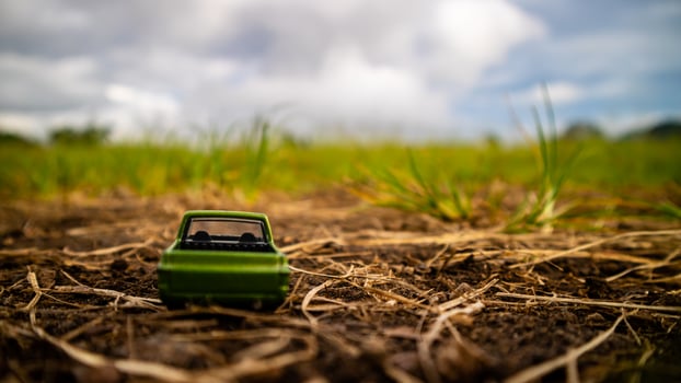 South Minahasa, Indonesia  February 2023, toy car on green grass photo