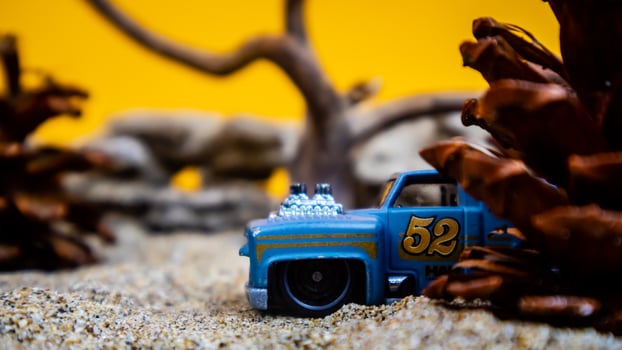 Minahasa, Indonesia  saturday, December 2022, a toy car among the pinecones photo